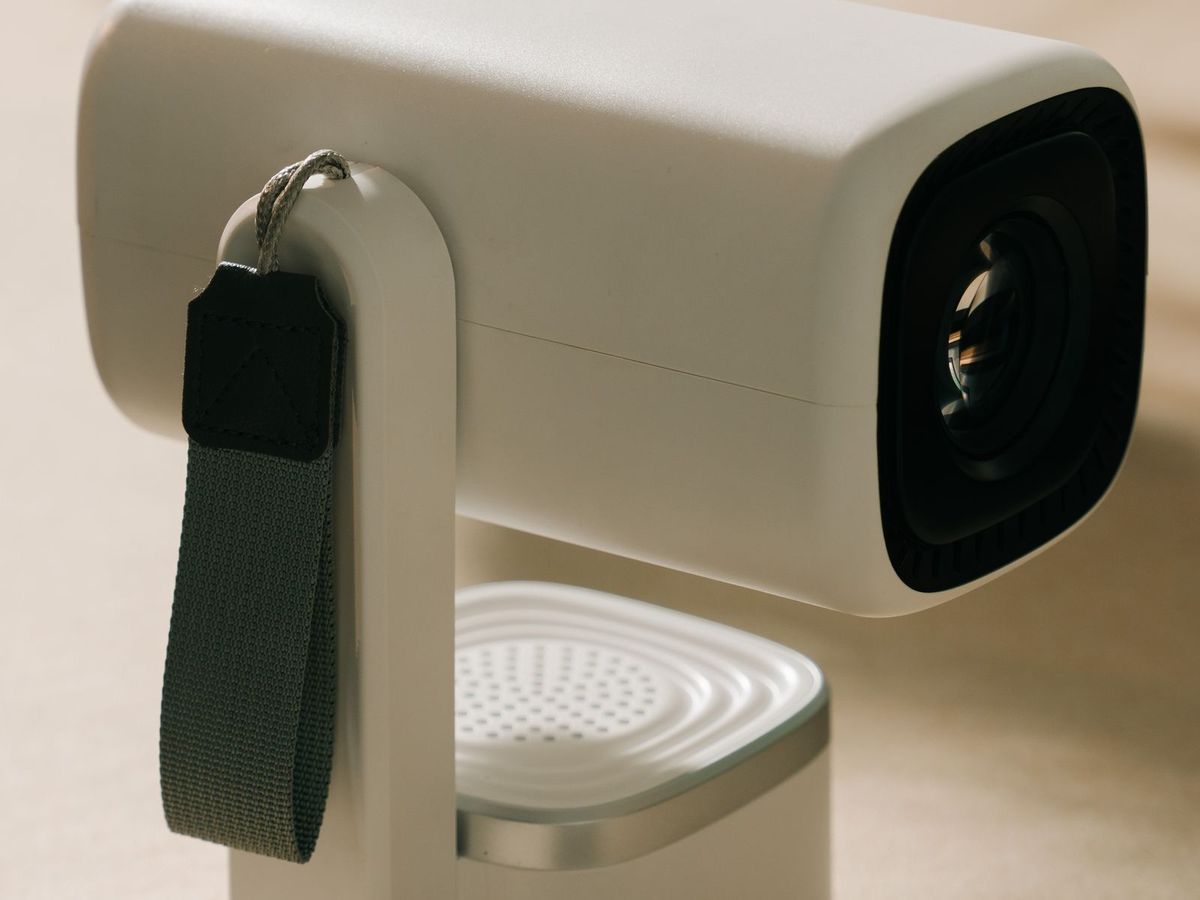 Mini-projecteur blanc compact avec dragonne